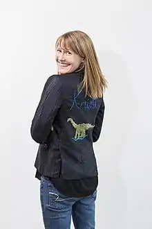 Rogers in a dinosaur-embroidered blazer