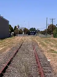 A new toilet block physically cuts the line near the former station