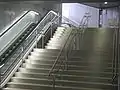 Escalators and fixed stairs at the access to the upper hall from the street