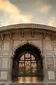 A view at sunset of the pavilions carved marble screens