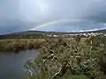 Western shore of Lake Seppings with Mount Adelaide and rainbow in the background