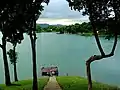 Lake surrounded by hills during winter