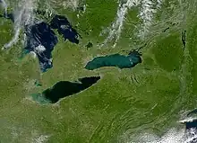 Lake Ontario and the Eastern Great Lakes and Hudson Lowlands from a satellite. Note dark green of Adirondack forests to right.