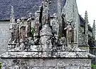 The south face of the Quilinen calvary. Various apostles stand around the pedestal's platform.