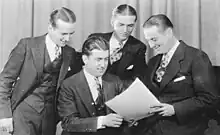 Very early picture of the Landt Trio & White showing Karl, Jack, and Dan standing, Howard White seated.