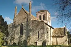 West view of church showing Early English lancet windows and tall 16th century pinnacles