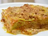 Green lasagna (made with spinach in the dough), with ragù, Parmesan and béchamel, typical of Bolognese cuisine