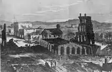 Lawrence in ruins, following Quantrill's Raid, as illustrated in Harper's Weekly. The ruins of the Eldridge House are in the foreground.