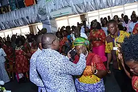 image of modern day African service in Ghana with laying on of hands