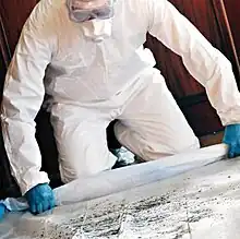 Man removing lead paint