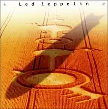 A zeppelin flying across a crop circle