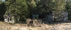 Guard house, gas and oil shack, and warehouse in Lester