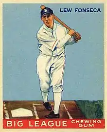 A baseball card image of a man in a white old-style baseball uniform and a navy-blue baseball cap following through on a swing with the bat toward his left shoulder