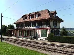 Two-story station building with hip roof