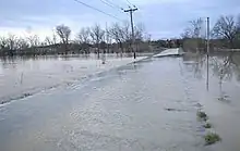 Lick Creek floods over Pottertown Road in Mosheim.