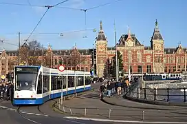 Line 26 tram running around a loop in front of Centraal station