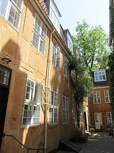 Courtyard: The perpendicular wing seen to the left.