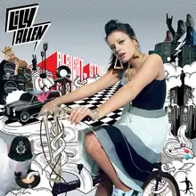 Lily Allen, with her hair up wearing a skirt and top, sits among many drawings of cultural objects.