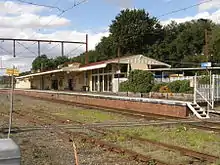 Northbound view of former station building and platform, March 2019