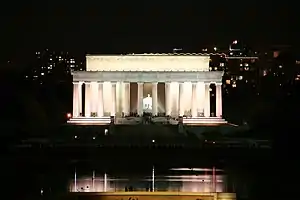 An photo a large white building with big pillars.