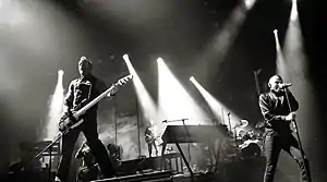 Linkin Park performing in October 2010. From left to right: Joe Hahn, Dave Farrell, Brad Delson, Mike Shinoda, Rob Bourdon and Chester Bennington.