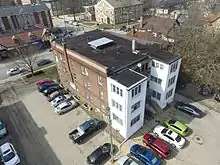 An aerial view of the existing 3-story apartment building renovated by Illinois Solar Decathlon as part of the 2016 Race to Zero project.