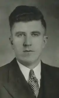 Black and white photo of Lloyd Pollock in a suit and tie