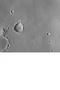 Lobate ejecta in Amenthes. Large crater has lobate ejecta, smaller craters do not show such ejecta since the ice layer was not penetrated by the smaller impacts.