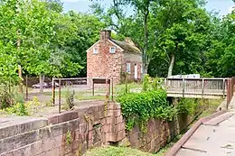 canal lock and old house