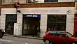 A single storey stone and glass building with "London Bridge Station" incised into the stonework above the entrance