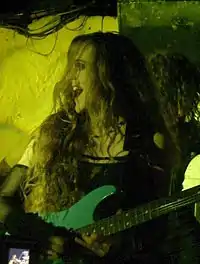 Lori Linstruth performing guitar with Stream of Passion in 2006.