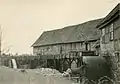 ca 1960:the sawmill (left) and flour mill (right), each with an overshoot water wheel