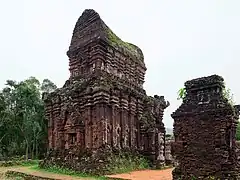 The B5 structure, a stone storehouse with distinctive boat-shaped roofs exemplifying Champa architecture in Mỹ Sơn, southern Vietnam. (c. 10th century)