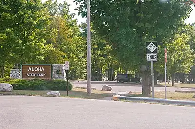 M-212's western terminus at Aloha State Park