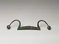 Chinese bronze rein holder, ca. 11th century BCE. The span is 38.7 cm.