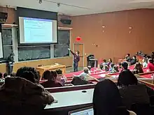 High school students attending a lecture on "Quantum Physics in Flatland" at MIT at Splash 2018