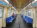 Interior of second generation trains. With 3 rows of handrails and hanging strap. Along with dynamic route map.