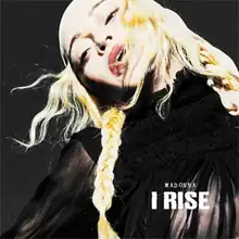 Picture of a blond woman dressed in black; she's wearing a white bandana and has her hair braided. The words MADONNA and I RISE are written in white capital letters on the bottom right corner