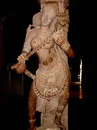 Statue of a musician playing a kinnari vina at the Airakkal Mandapa (Thousand Pillar Hall) in the Meenakshi Temple, Madurai.