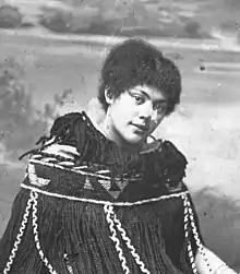 Black and white photograph of Māori woman in a traditional native cloak