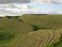 Iron Age ramparts and ditches in Maiden Castle.