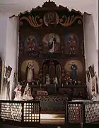 Main altar, San Jose de Gracia, 1943. The main altar screen (and others in the church) were overpainted in 1860 by the Mexican santero Jose de Gracia Gonzales. FSA photograph.