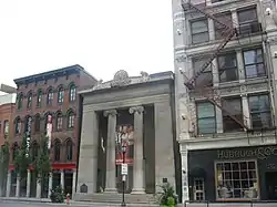 A tall gray building with two central pillars