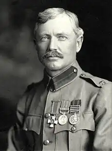 Burnham portrait photograph taken in 1901. He is dressed in his British Army uniform, with major insignia, Distinguished Service Order Cross, British South Africa Medal, and Queens South Africa Medal.