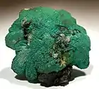 Unusual cerussite with a coating ingrained into the surface of microcrystalline malachite and linarite that give it a rich blue-green color