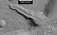 Layered deposit in Mamers Valles, as seen by HiRISE.