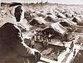 A Palestinian watches over a school in a refugee camp, 1948.