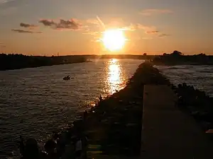 Image 19The Jersey Shore extends inland from the Atlantic Ocean into its many inlets, including Manasquan Inlet, looking westward at sunset from the jetty at Manasquan. (from New Jersey)