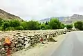 Mani wall along the driveway to Hemis Monastery