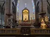 The cathedra, newer high altar, pulpit, and altar rail, with the image of the Immaculate Conception under the ciborium